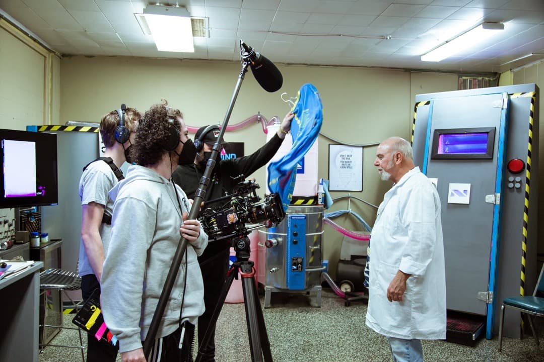 Behind the scenes photo 61 from Clone Cops production showing 2nd ac david king, boom operator jared grimes, cinematographer corey allen, and henry haggard prepare for a scene